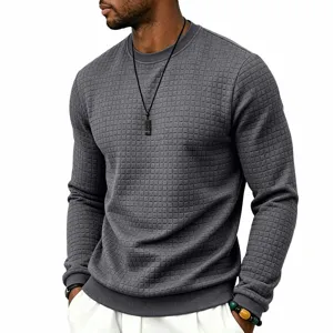 Close-up of the textured grid pattern on the men's long-sleeve crewneck sweater.