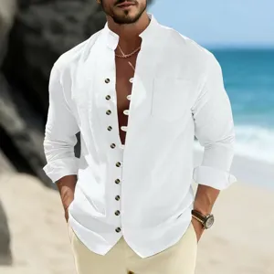 Close-up of casual white linen long-sleeve shirt worn by model on a scenic beach setting.