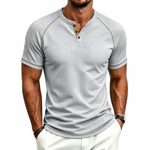 Close-up detail of men's grey waffle knit short-sleeve Henley shirt with contrast trim.