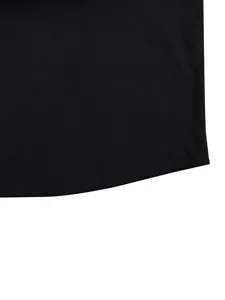 Black shirt hem detail showing fine slub fabric texture and clean curved stitching.