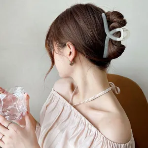 Large translucent jelly cross hair claw clip for women, stylish minimalist hair styling accessory.