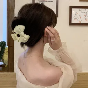 Matte bow hair claw clip for elegant hairstyles and daily updos back head styling accessory