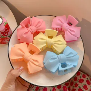 Matte pastel bow hair claw clips set for women, cute non-slip hair styling accessories.