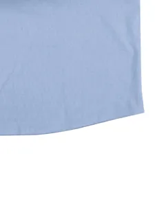 Light blue casual shirt fabric detail showing fine slub texture and neat hem stitching.