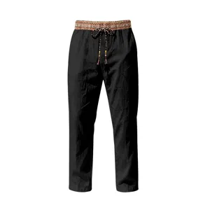 Men's casual linen trousers detail showcasing ethnic print waistband and adjustable drawstring.