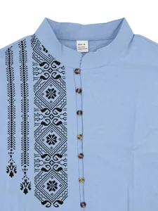 Detail view of light blue men shirt collar, ethnic print and multi-button design.