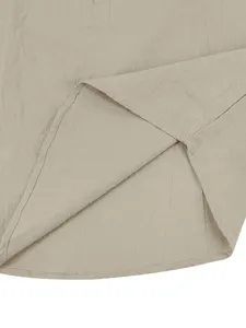 Detailed view of the casual linen-blend long sleeve shirt hem, showing fine fabric texture.