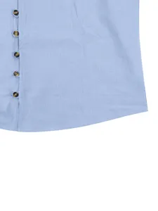 Close-up detail of mens long sleeve casual shirt button placket and curved hem in light blue.