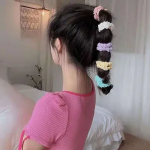 Detailed view of colorful mesh hair scrunchies showcasing the sweet style and elastic design.