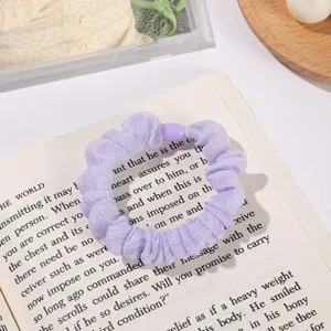 Purple mesh scrunchie detail shot, sparkling fabric hair tie, sweet cute everyday hair accessory.