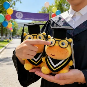Close-up detail of cute graduation capybara plush toy wearing a cap, glasses, and stole.