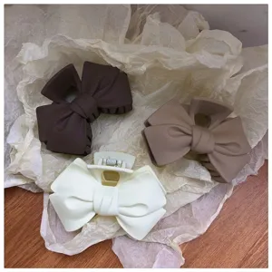 Matte bow hair claw clip set, elegant hair accessories for women and girls daily styling.
