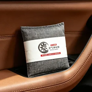 Detail view of car bamboo charcoal air purifying bag, placed in interior storage for odor removal.