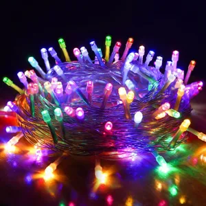 Colorful LED string lights close up, glowing multicolored bulbs on transparent wire for room decor