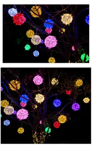 Hanging LED rattan ball lights detail view, colorful glowing spheres for outdoor tree decoration.