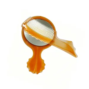 Portable makeup mirror and comb set, small plastic hair styling tool two-piece kit for travel.