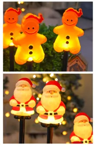 Close-up detail of Christmas LED ground stake lights featuring cute gingerbread and Santa.