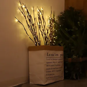 Luces LED de ramas artificiales con base de bolsa de papel, decoración muy cálida.