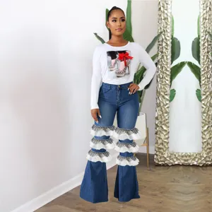 Jean évasé taille haute pour femme avec volants en tulle étagés, pantalon stylé.