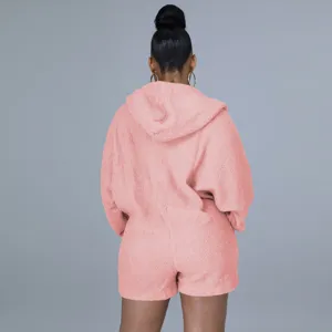 Back view of a pink fuzzy fleece hooded romper with batwing sleeves, cozy loungewear.