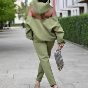 Women solid color casual backless long sleeve hoodie and matching trousers two piece set.