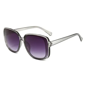 Oversized square sunglasses with gradient purple lenses and clear grey frames for women.