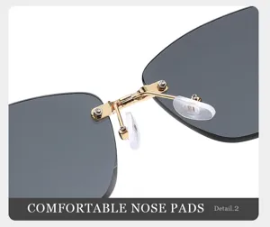 Primer plano detalle de almohadillas de gafas de sol y bisagra dorada, gran calidad.