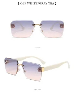 Lunettes de soleil sans monture avec verres dégradés, branches blanches et détails dorés.