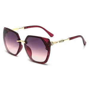 Women fashion polygon sunglasses with wine red gradient lenses and delicate rhinestone temples.