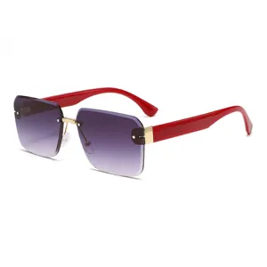 Lunettes de soleil femme sans monture verres dégradés et branches rouges UV chics