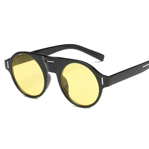 Lunettes de soleil rondes noires avec verres jaunes vifs et détails métalliques.
