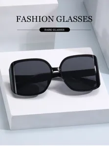 Stylish oversized black sunglasses with multi-faceted curved lenses for a modern chic street style.
