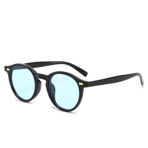 Vintage round sunglasses with light blue lenses and chic double dot rivets for men and women.