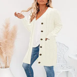 Cable knit long cardigan detail view, open front with buttons and cozy pocket design feature.