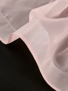 Exquisite detail of pink mesh fabric, soft texture and delicate hem for chic women skirt.