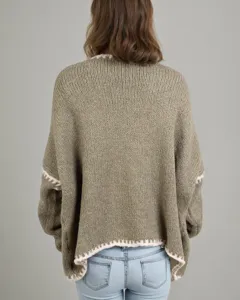 Back detail of loose olive green knit cardigan sweater with white crochet trim for women.