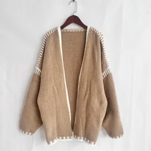 Detailed view of women's autumn winter loose chunky knit cardigan sweater daily outerwear.