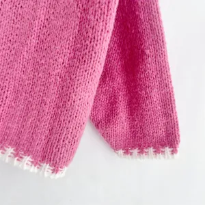 Pink knit sweater cuff detail, cozy coarse knit long sleeve cardigan, winter fashion apparel.