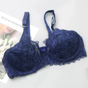 Dark blue lace push-up bra with floral embroidery, adjustable straps and front bow detail.