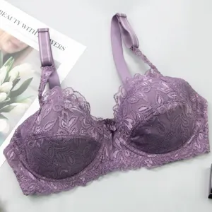 Detail view of purple lace push up bra showing exquisite floral embroidery and straps.