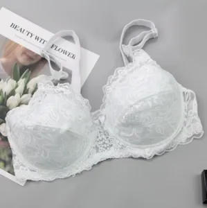 Detailed view of white lace bra featuring exquisite floral patterns and comfortable adjustable straps.