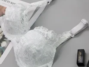 White lace push-up bra detail showing exquisite floral fabric and adjustable straps.