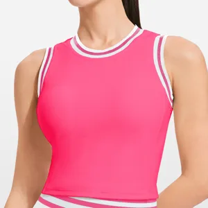 Pink crop athletic top with contrast striped ribbed trim, sleeveless fitness yoga vest detail.