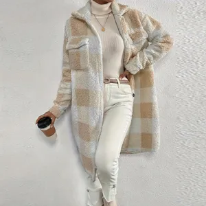 Detailed view of women's cozy fleece plaid coat featuring long sleeves and a stylish lapel.