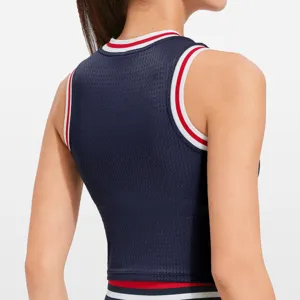 Women athletic mesh crop top in dark blue with red and white ribbed trim, back view detail.