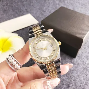 Luxurious gold and silver women's quartz watch with diamond bezel and calendar function.