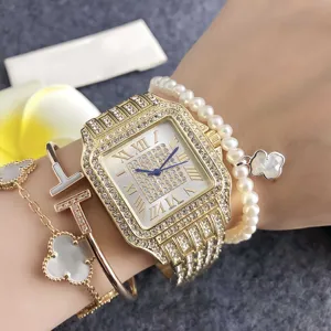 Elegante goldene Damen-Uhr mit Strasssteinen, römischen Ziffern und luxuriösem Armband-Set.