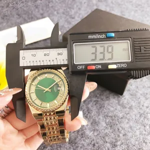 Gold rhinestone women quartz watch detail showing 33.9mm dial size with caliper measurement.