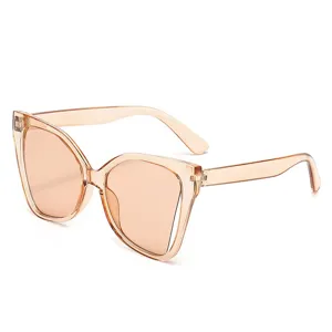 Fashion oversized butterfly sunglasses with translucent beige frame and brown gradient lenses.
