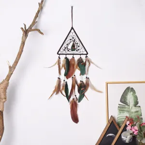 Boho triangular dream catcher wall hanging with feathers and beads for home bedroom decor.